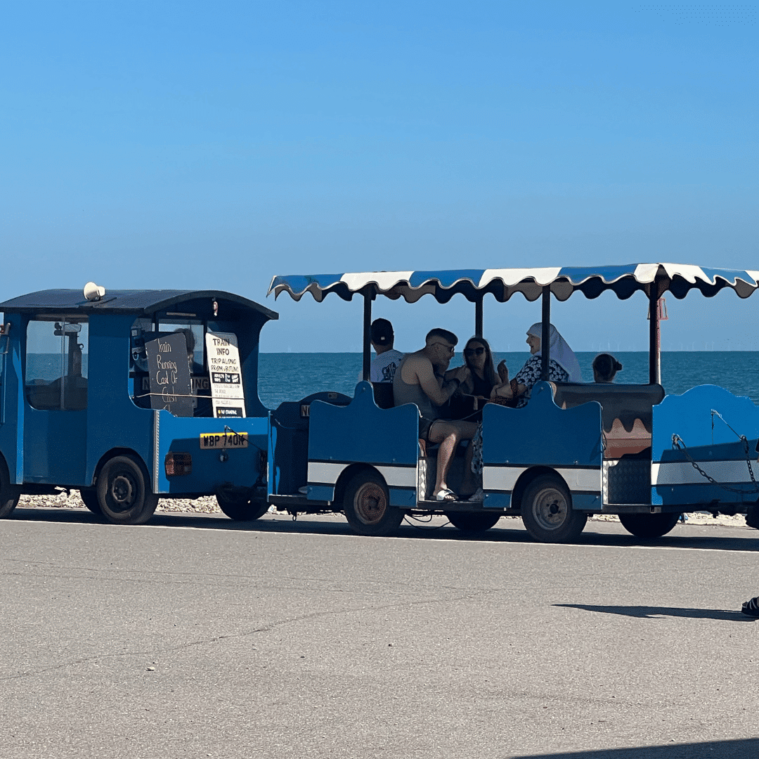 A small blue tourist train with people riding, parked by the seaside under a clear blue sky.
Websites For Accountants UK That Build Trust